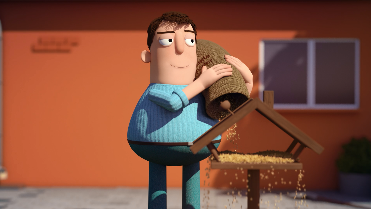 Fumle står ved fuglefoderbræt med en sæk